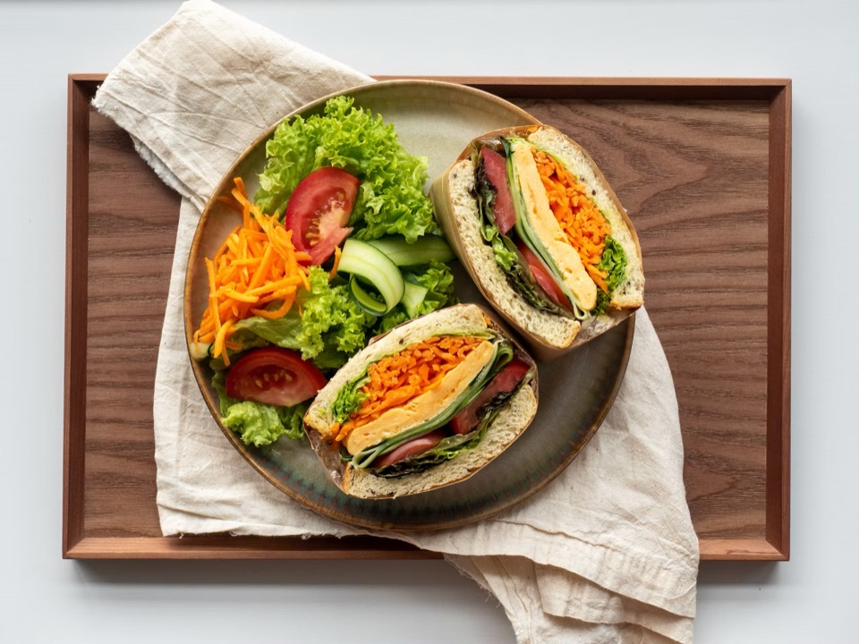 Egg sandwich with a side salad